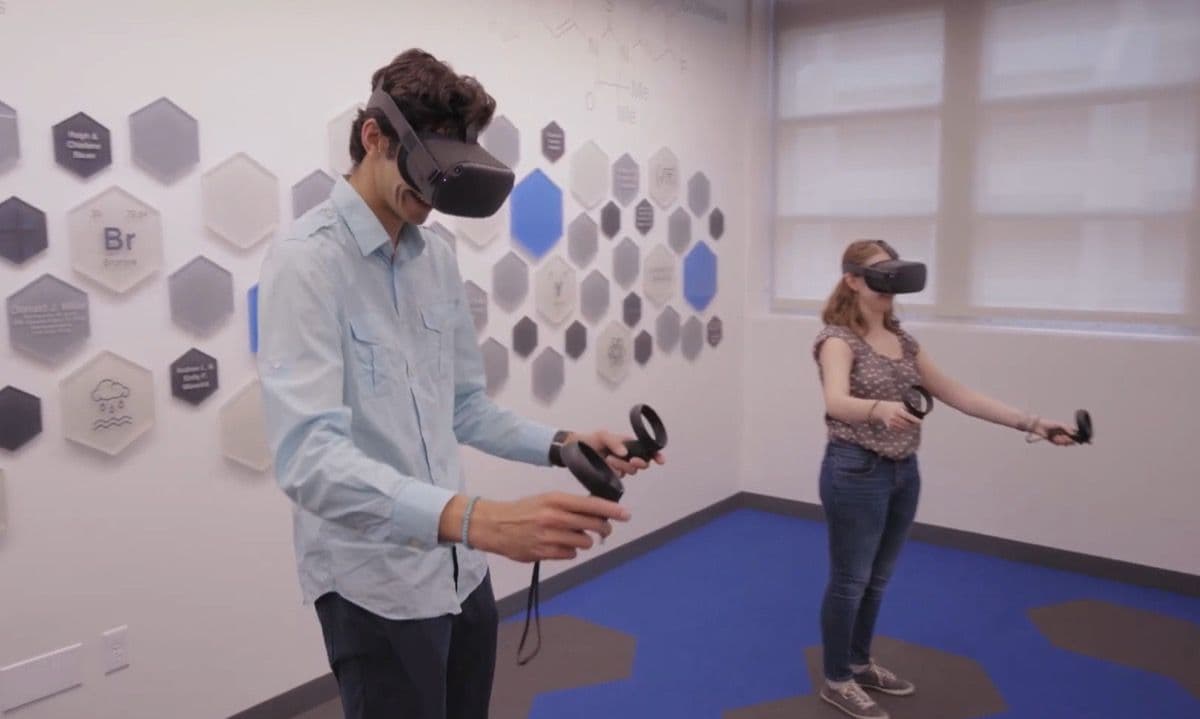 Two students exploring molecules together in VR